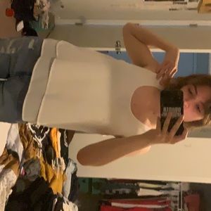 Medium white dressy tank top. It’s super flowy and light material.